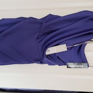 The runway, Halston one shoulder  dress in violet.